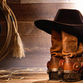 cowboy hat on boots